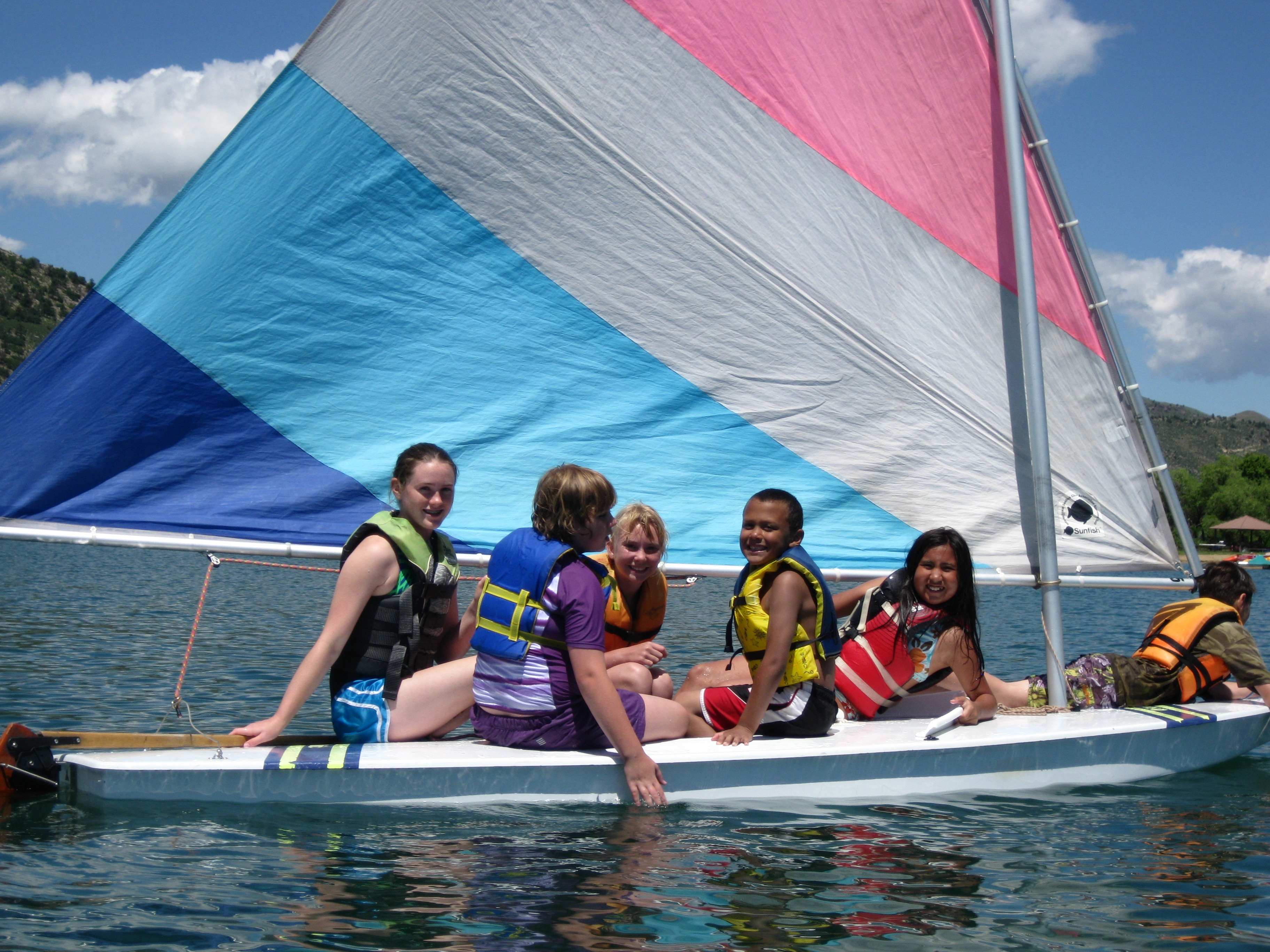 Youth sail on a boat during Camp Eco.