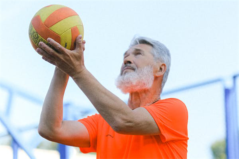 Senior Playing Volleyball