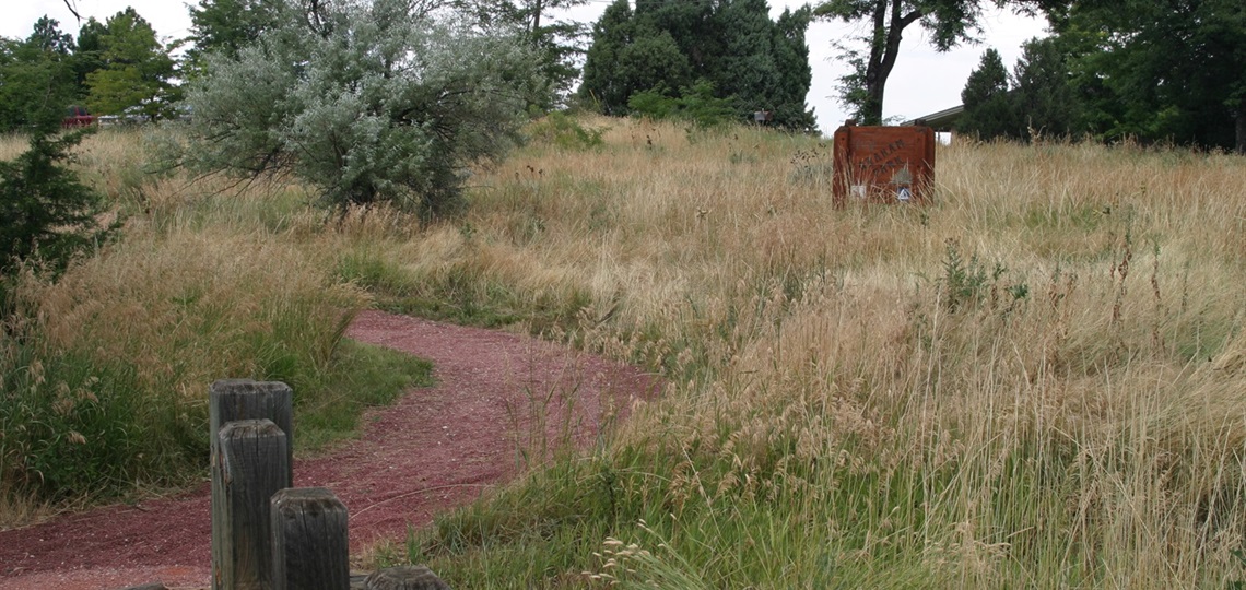 Graham Park with walking trail and park sign