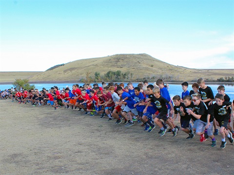 A cross country race starts at Bear Creek Lake Park.