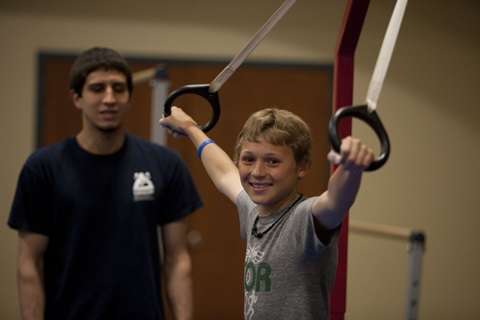 Boy on gymnastics rings