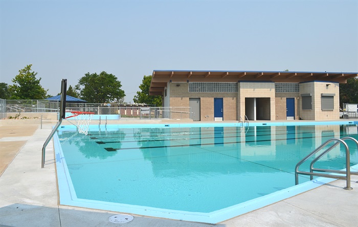 The pool shallow end with basketball hoop.