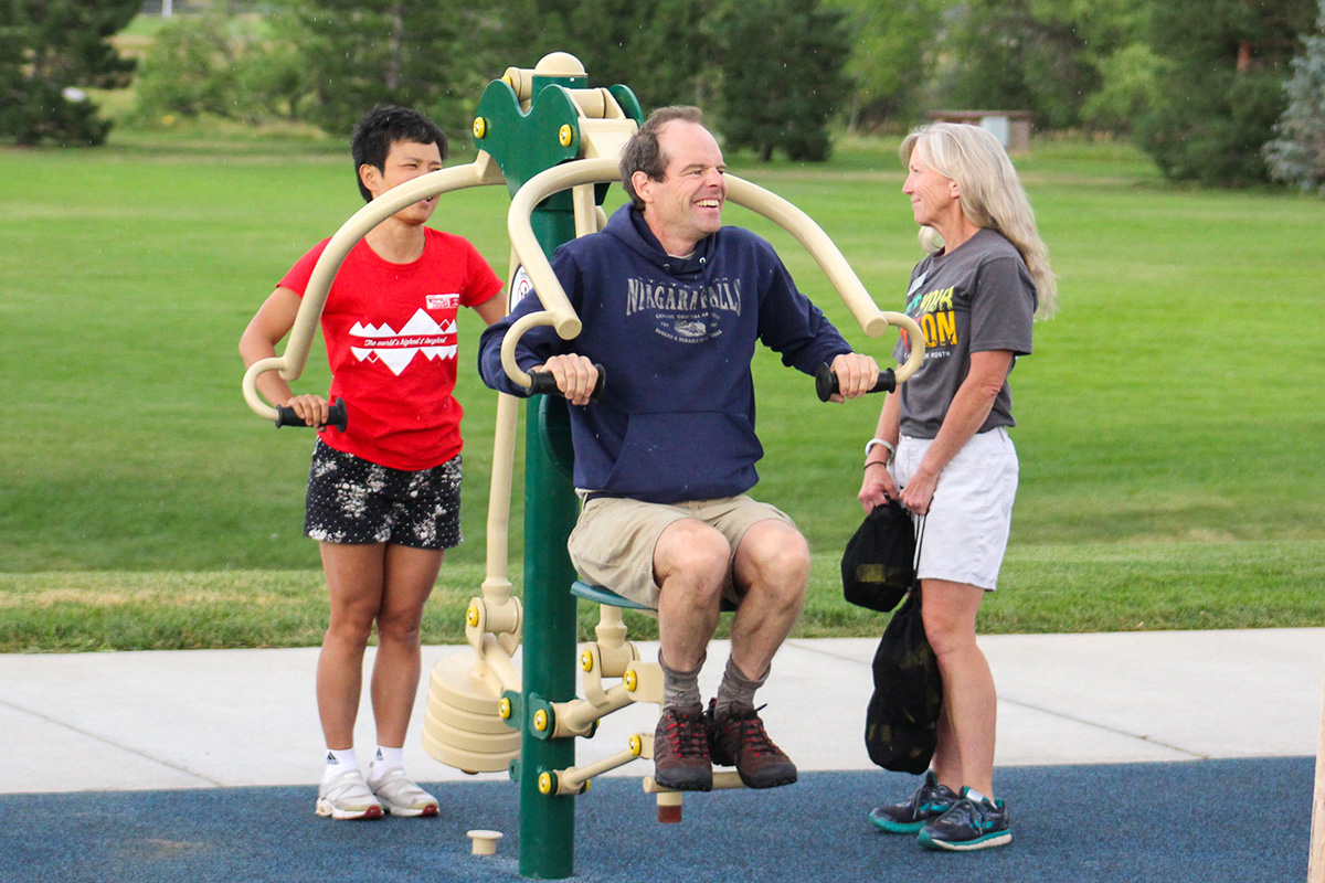 Three people use the fitness zone.