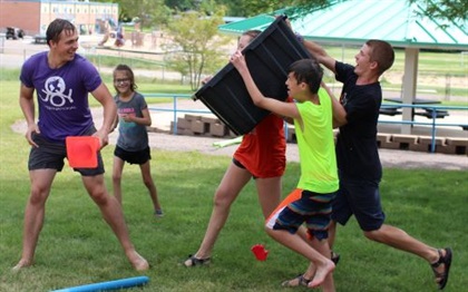 Camp Paha campers enjoy a wet, splashy water fight