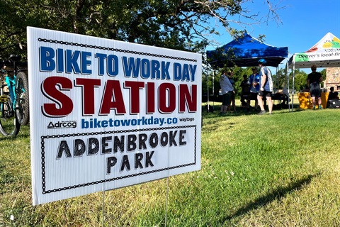 Sign in the grass that reads Bike to Work Day Station Addenbrooke Park