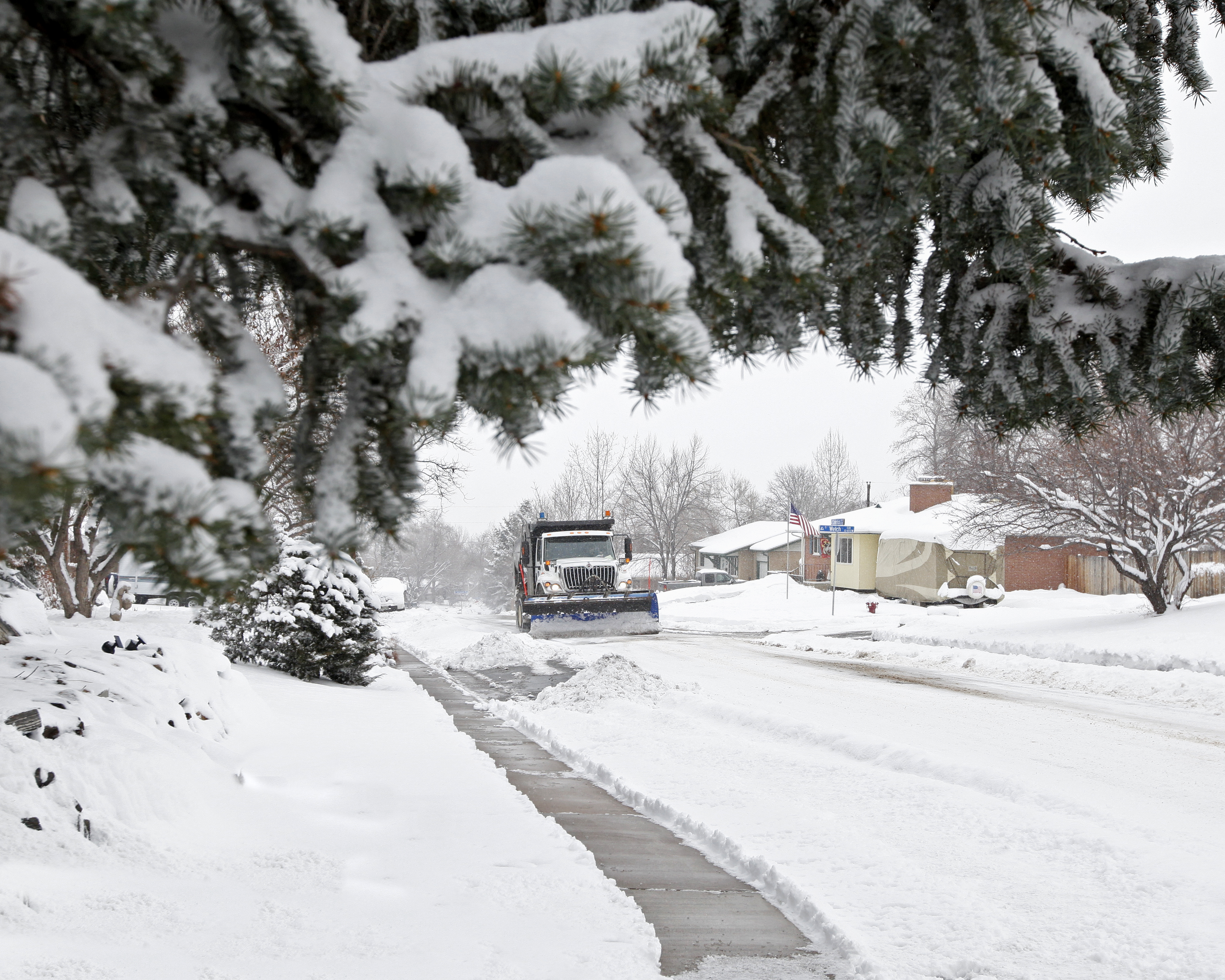 A sidewalk that has been shoveled. 