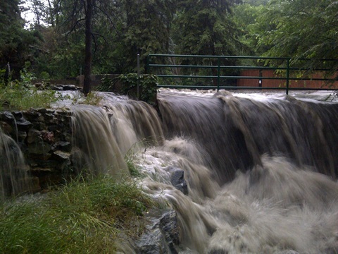 flood waters running through a gate