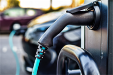 Electric Vehicle plugged in to charging station