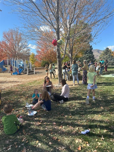 Dozens of neighborhood children and their parents gathered to decorate pumpkins at Coyote Gulch Park.